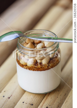 Glass jar with delicious yogurt Glass jar with delicious yogurt 38820338
