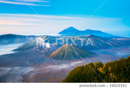 Mount Bromo during sunrise with flowing fog 38820341