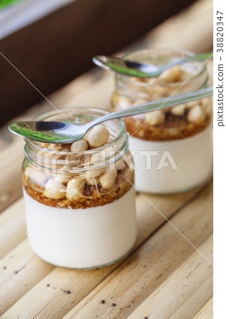 Glass jars with delicious yogurt Glass jars with delicious yogurt 38820347