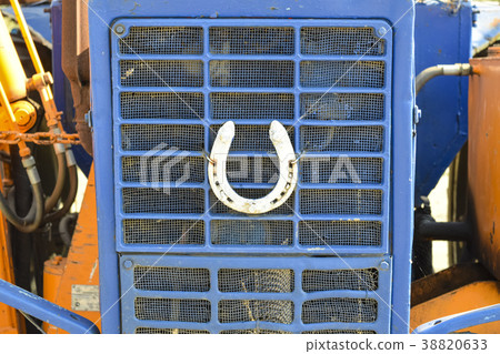 Horseshoe on the hood of the tractor 38820633