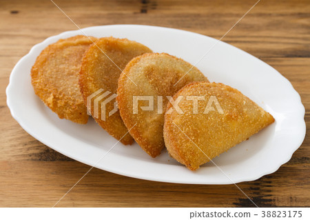 portuguese meat cookies on white dish  38823175