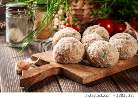 Raw meatballs rolled in a crispy bun 38823355