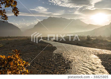 mountains and hills in the rays of the evening sun mountains and hills in the rays of the evening sun 38825805
