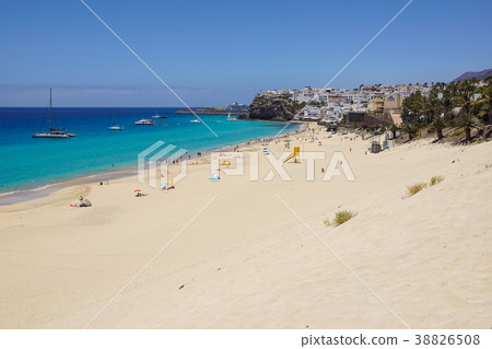 Sand dune and coastal promenade along a beach in Sand dune and coastal promenade along a beach in 38826508