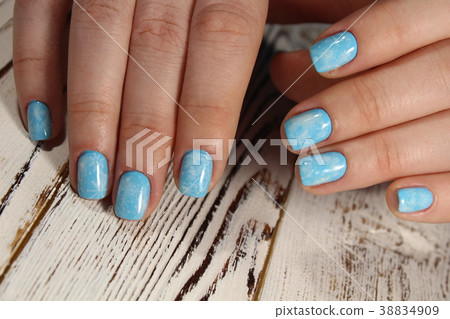Christmas design manicure with snowflakes. Christmas design manicure with snowflakes. 38834909