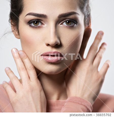 Portrait of an young beautiful woman with smoky eyes makeup. Portrait of an young beautiful woman with smoky eyes makeup. 38835702