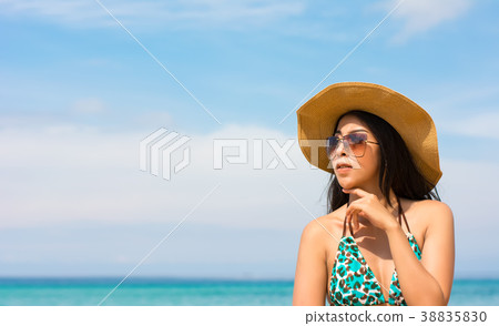 Asian woman on beach are posted to take a photo Asian woman on beach are posted to take a photo 38835830