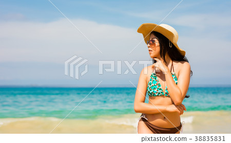 Asian woman on beach are posted to take a photo Asian woman on beach are posted to take a photo 38835831