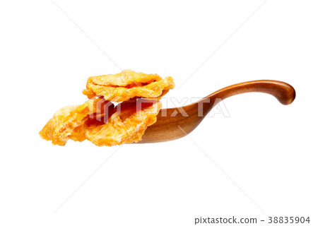 Dried pineapples slices in the wooden spoon Dried pineapples slices in the wooden spoon 38835904