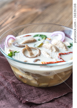 Glass bowl of thai tom kha kai soup 38836108