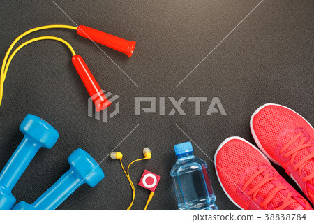 Top view of sports equipment, dumbbells, a Top view of sports equipment, dumbbells, a 38838784