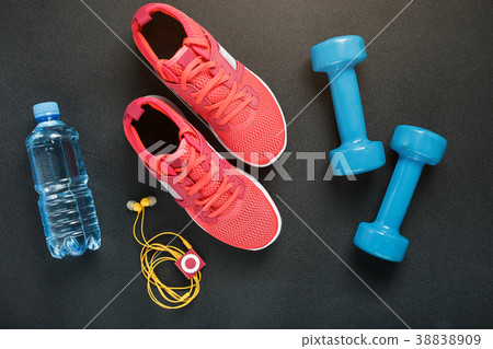 Top view of sportswear, dumbbells and digital Top view of sportswear, dumbbells and digital 38838909