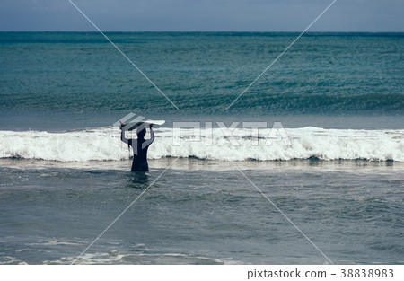 woman surfer with surfboard ready for surfing 38838983