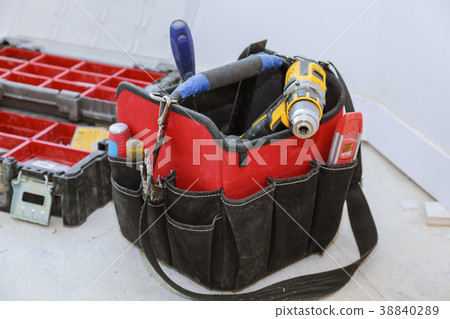 set of tools in a bag on wooden background 38840289