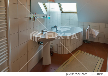 Modern bathroom with bath, washbasin and window. 38840940