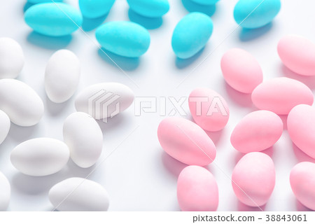 blue, pink and white sugared almond candies 38843061