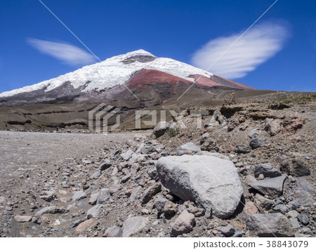 Snow capped Cotopaxi volcano with clouds like wing Snow capped Cotopaxi volcano with clouds like wing 38843079