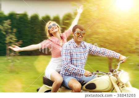 beautiful couple on retro motorbike beautiful couple on retro motorbike 38843203