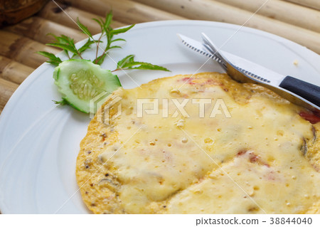 Cheese omelette with cucumber 38844040