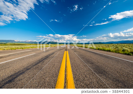 Empty open highway in Wyoming 38844301