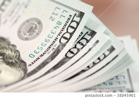 A pile of one hundred US dollar bills 38845901