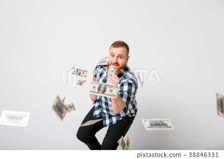 man standing under money rain 38846331