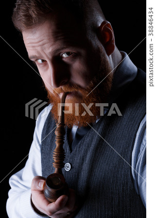 man smoking a pipe 38846434