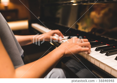Woman playing piano, music instrument concept 38846948