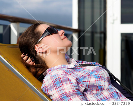 woman resting on the lounger 38847259