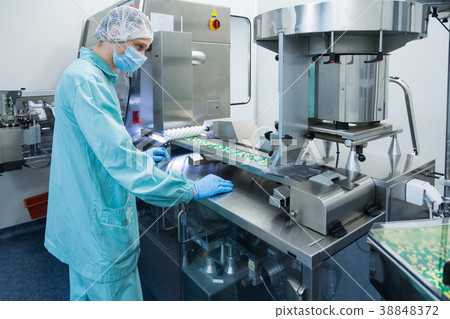 Pharmaceutical industry man worker in protective 38848372