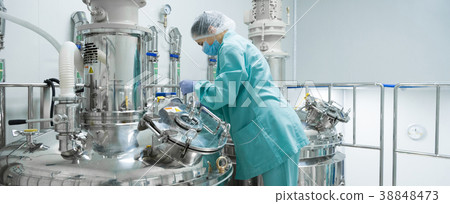 Pharmaceutical factory woman worker in protective 38848473