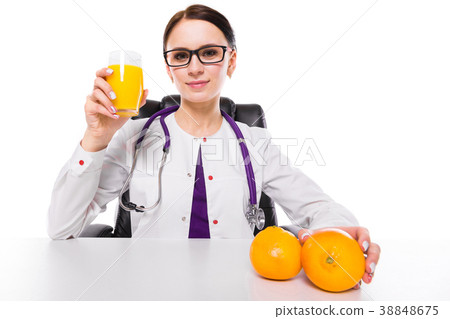 Female nutritionist sitting in her working place 38848675
