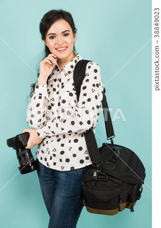Young woman with camera and its case 38849023