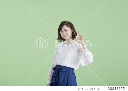 Young Woman OK Sign Green Back 38855355