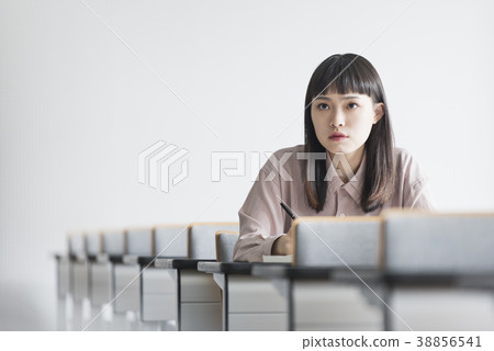 Female college student studying in lecture hall 38856541