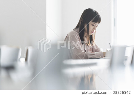 Female college student studying in lecture hall 38856542