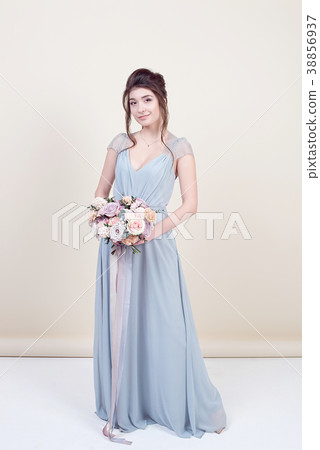 female model holding a bouquet of flowers 38856937