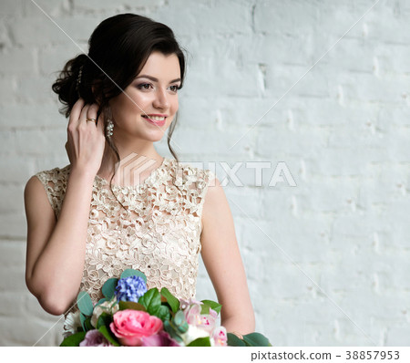 Half length portrait of brunette smiling woman 38857953