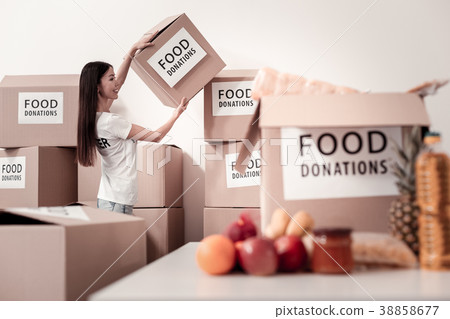 Charming girl collecting paper boxes Charming girl collecting paper boxes 38858677