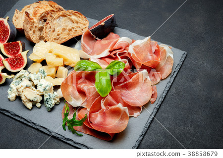 Italian prosciutto crudo or spanish jamon, cheese Italian prosciutto crudo or spanish jamon, cheese 38858679