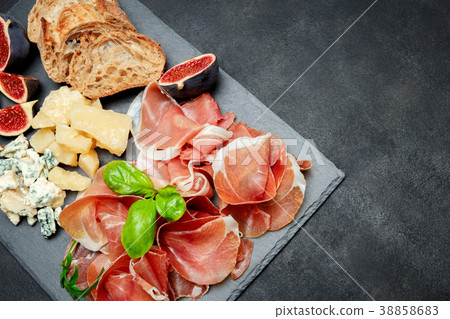 Italian prosciutto crudo or spanish jamon, cheese Italian prosciutto crudo or spanish jamon, cheese 38858683