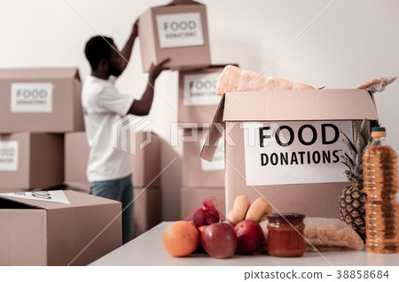 Silhouette of African man that putting box 38858684