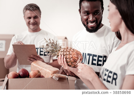 Handsome dark-skinned man smiling to his partner Handsome dark-skinned man smiling to his partner 38858698
