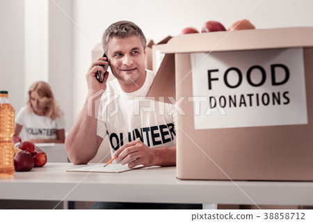 Portrait of delighted social worker while talking Portrait of delighted social worker while talking 38858712