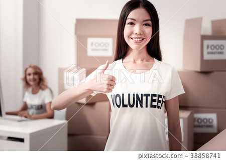 Portrait of delighted female that raising thumb Portrait of delighted female that raising thumb 38858741