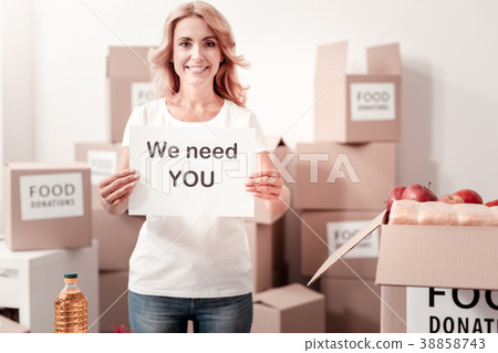 Cheerful female holding paper sheet Cheerful female holding paper sheet 38858743