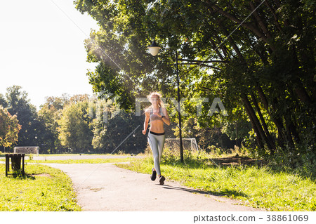 healthy lifestyle young fitness woman running 38861069