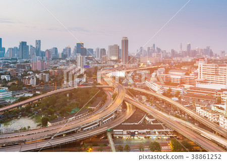 Highway intersection with business downtown  38861252