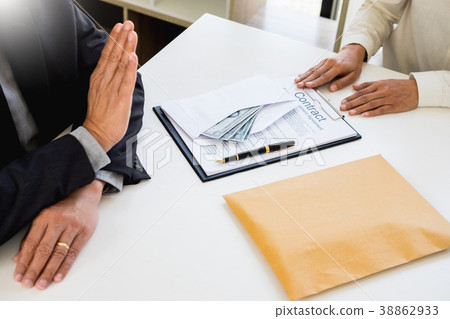 Businessman refusing or rejecting money in the envelope - anti b 38862933