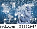 Finger touching network in front of glowing worl 38862947